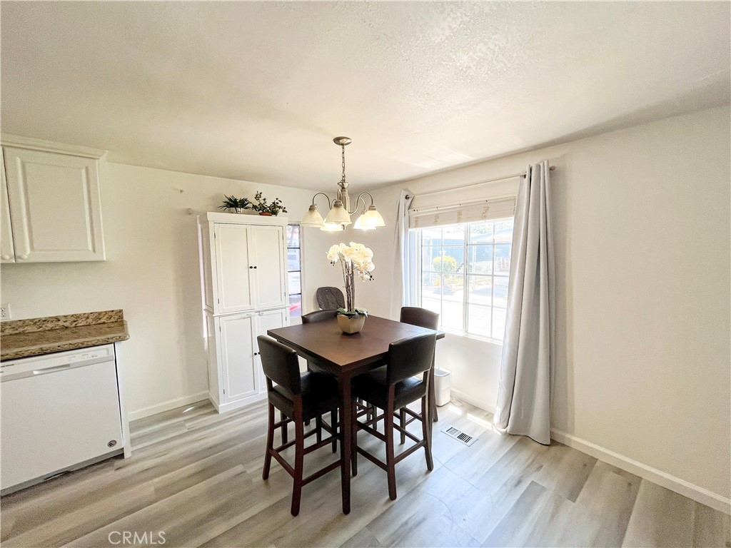 17700 Avalon Boulevard, Unit 40 Carson, CA 90746 - Photo 9 of 32 a view of a dining room with furniture window and wooden floor