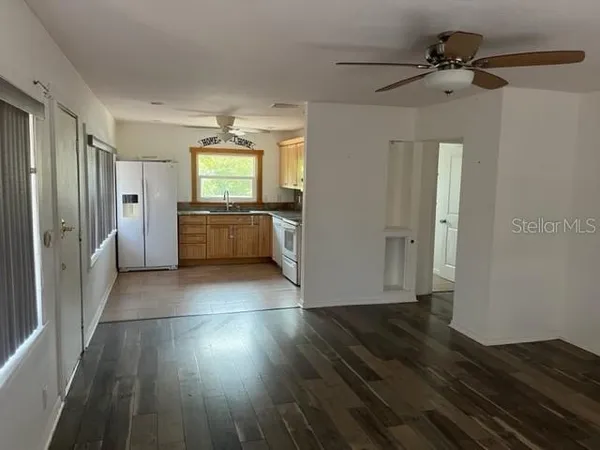 a kitchen with stainless steel appliances a refrigerator and a stove