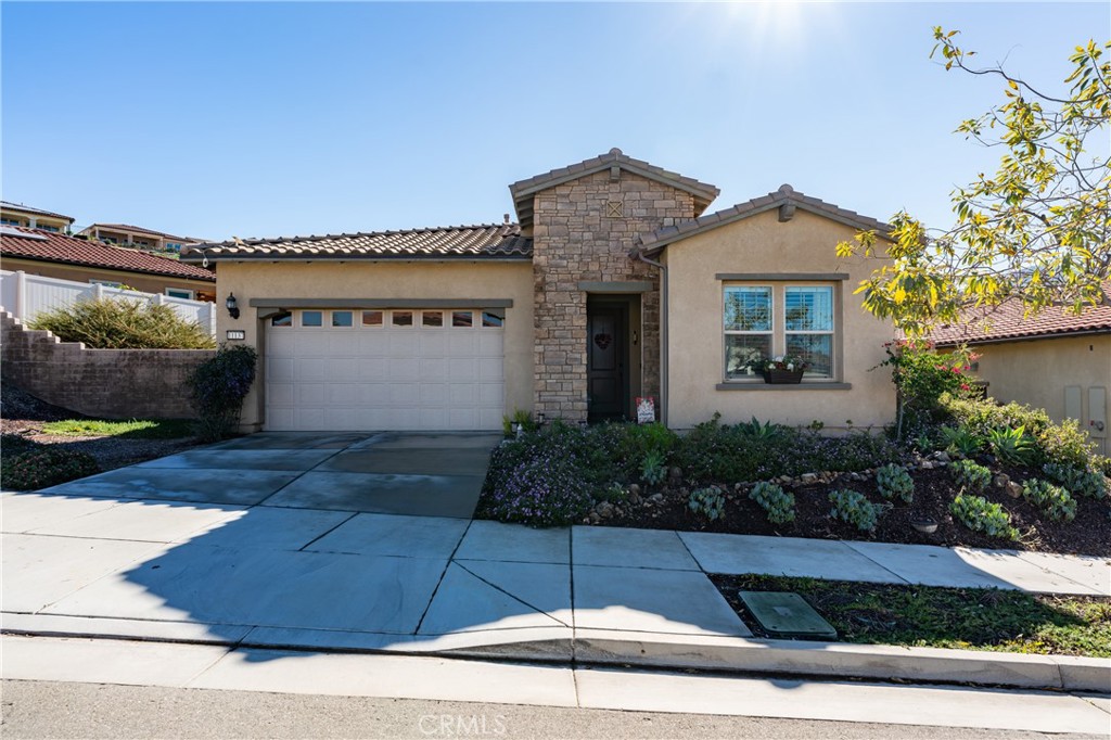 11137 Briar Rose Court Corona, CA 92883 - Photo 3 of 75 a front view of a house with garden