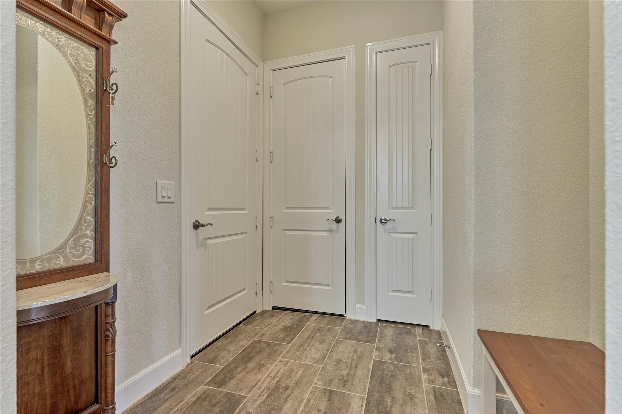 132 Chestnut Bay Spring, TX 77382 - Photo 12 of 33 a view of a hallway with wooden floor and closet