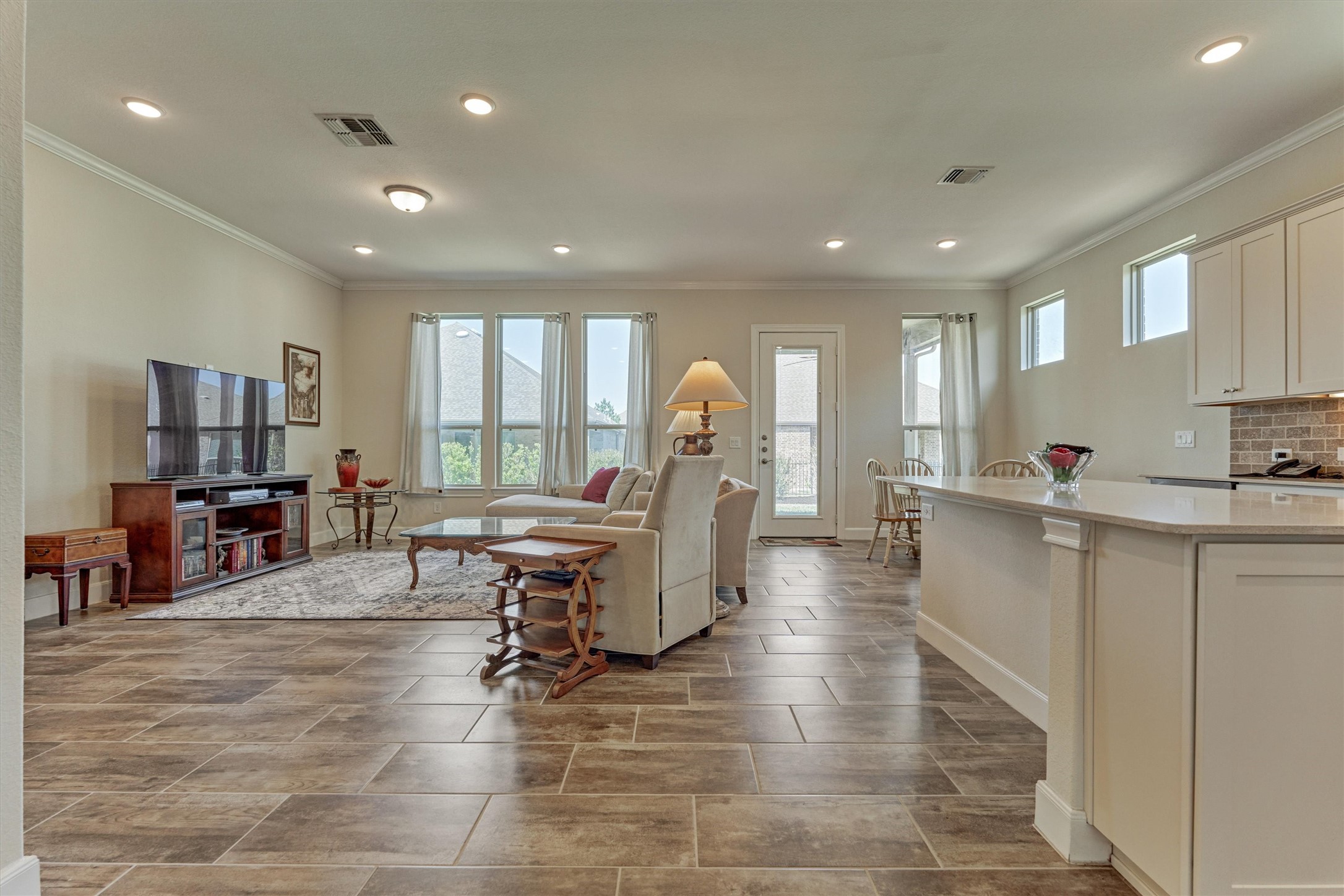 132 Chestnut Bay Spring, TX 77382 - Photo 13 of 33 a large white kitchen with lots of counter space and windows