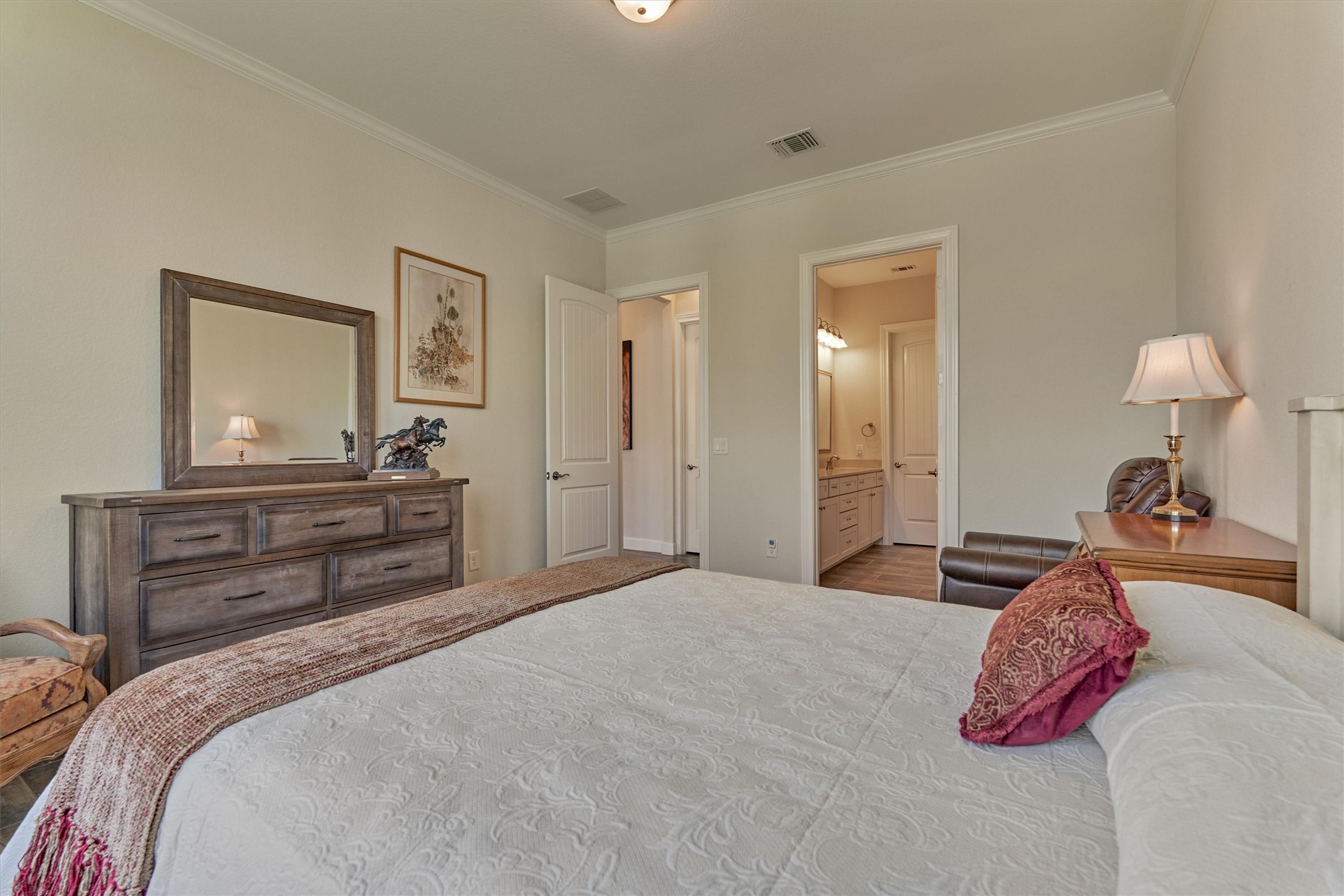 132 Chestnut Bay Spring, TX 77382 - Photo 25 of 33 a bedroom with a bed and a dresser