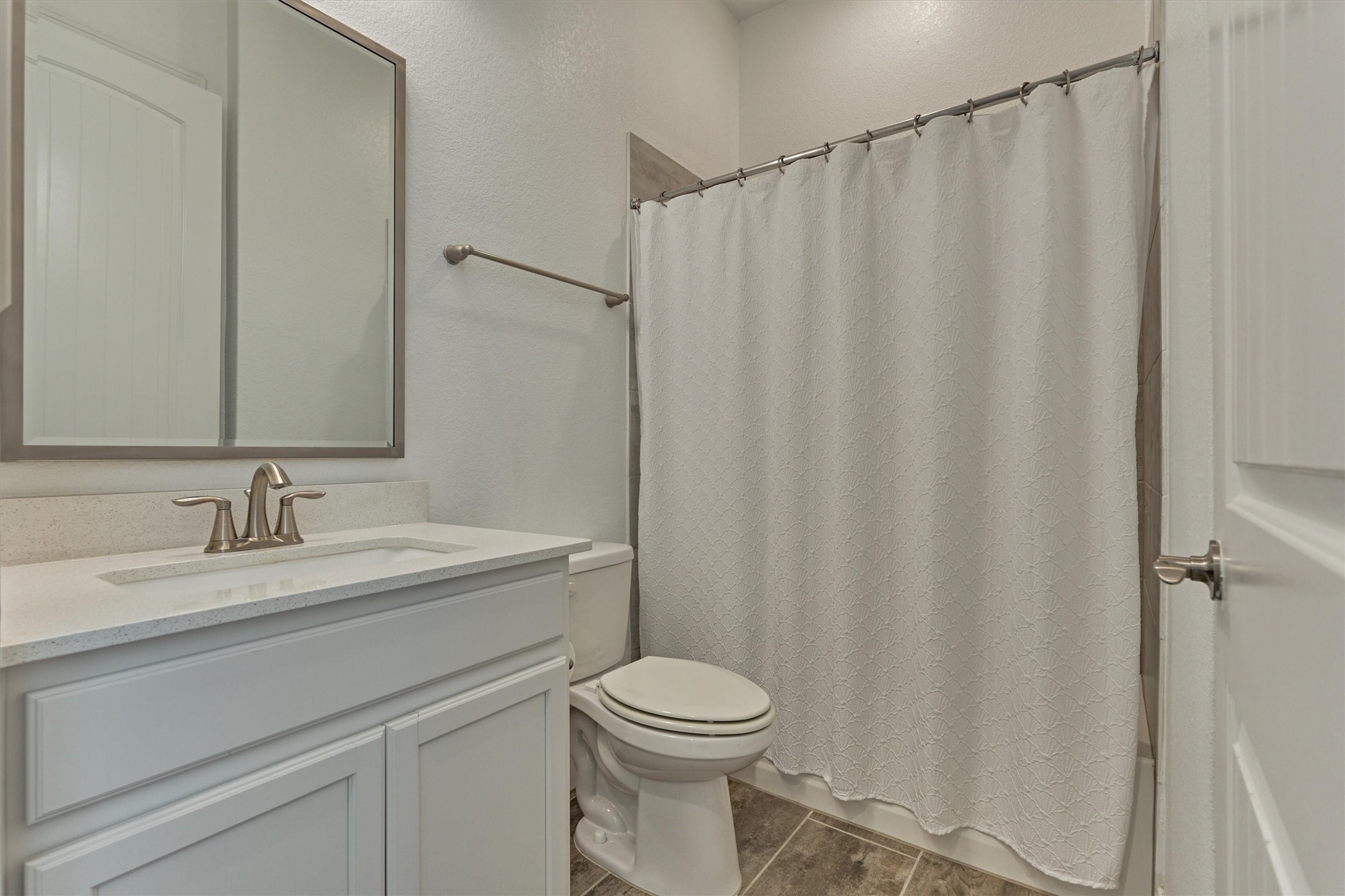 132 Chestnut Bay Spring, TX 77382 - Photo 8 of 33 a bathroom with a sink a toilet and shower