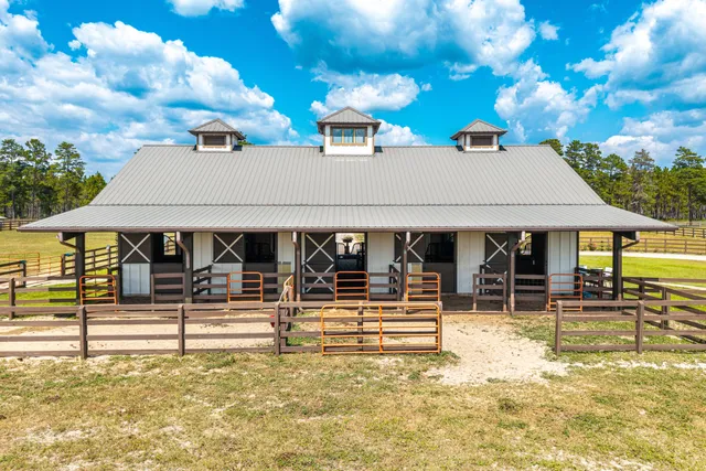 a view of a swimming pool with outdoor seating