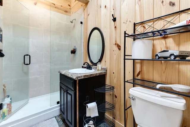 a kitchen with a sink stove top oven and cabinets