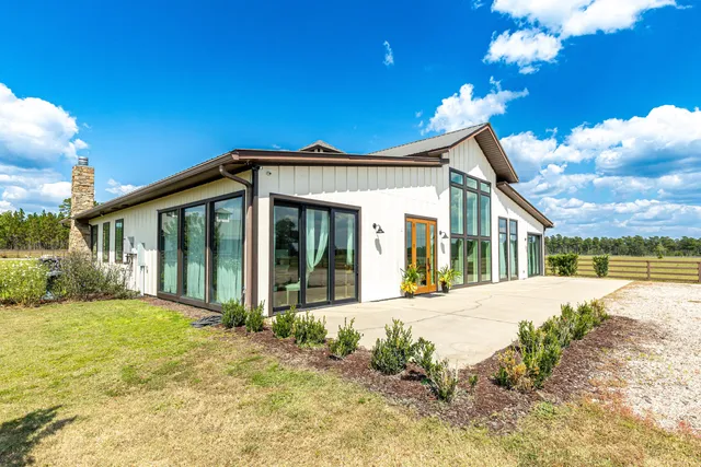 a bedroom with a bed a couch and a dresser