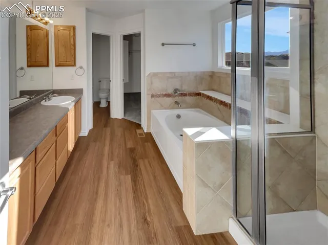 a bathroom with a tub and shower