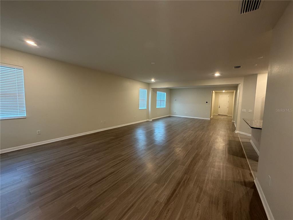 9448 Sanders Pk Place Seffner, FL 33584 - Photo 17 of 21 a view of an empty room with wooden floor