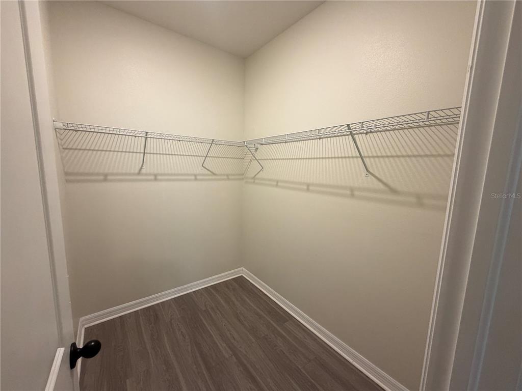 9448 Sanders Pk Place Seffner, FL 33584 - Photo 8 of 21 a view of a room with racks on the wall