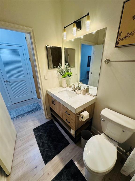 898 Oak Street Southwest, Unit 1214 Atlanta, GA 30310 - Photo 11 of 23 a bathroom with a toilet a sink and mirror