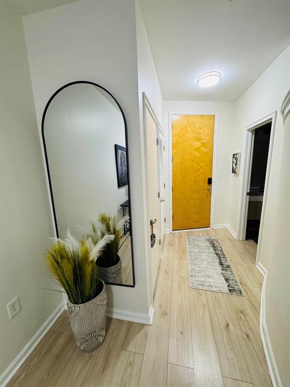 898 Oak Street Southwest, Unit 1214 Atlanta, GA 30310 - Photo 12 of 23 a view of a living room with a wooden floor