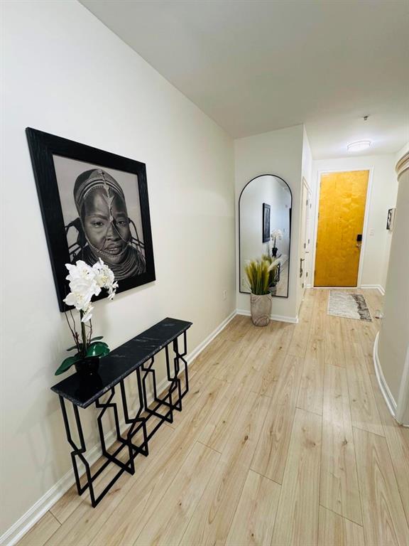 898 Oak Street Southwest, Unit 1214 Atlanta, GA 30310 - Photo 13 of 23 a view of a hallway with wooden floor and furniture