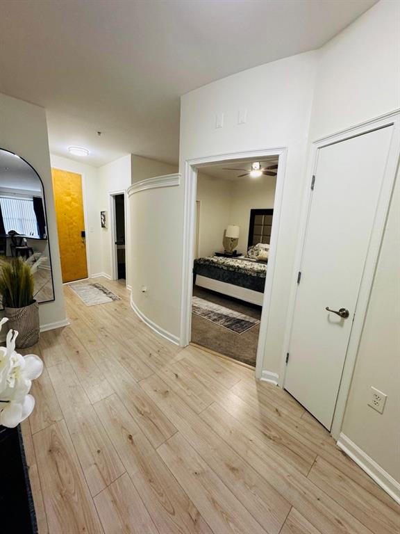 898 Oak Street Southwest, Unit 1214 Atlanta, GA 30310 - Photo 14 of 23 a view of a hallway with wooden floor and staircase