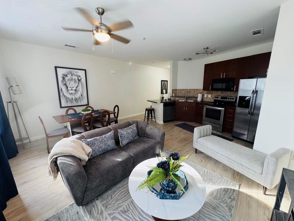 898 Oak Street Southwest, Unit 1214 Atlanta, GA 30310 - Photo 3 of 23 a living room with furniture or kitchen and a fireplace