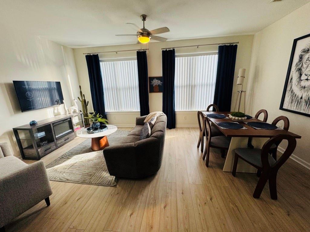 898 Oak Street Southwest, Unit 1214 Atlanta, GA 30310 - Photo 4 of 23 a living room with furniture and a flat screen tv