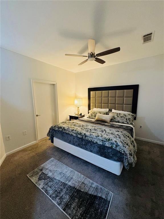 898 Oak Street Southwest, Unit 1214 Atlanta, GA 30310 - Photo 8 of 23 a bedroom with a large bed and a rug