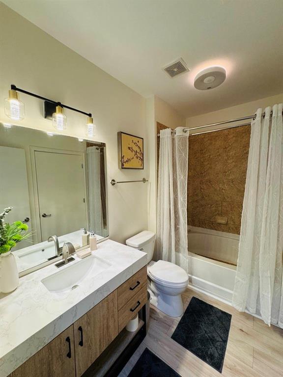 898 Oak Street Southwest, Unit 1214 Atlanta, GA 30310 - Photo 10 of 23 a bathroom with a sink a toilet a mirror and shower