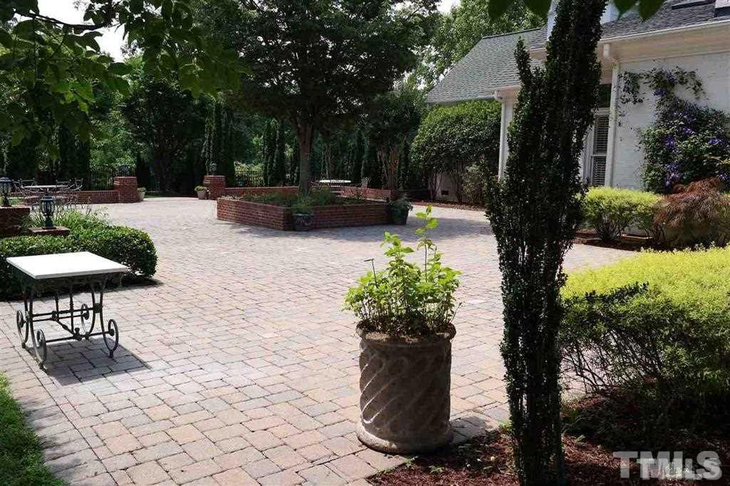 12928 Victory Church Road Raleigh, NC 27613 - Photo 3 of 25 a view of a backyard with sitting area