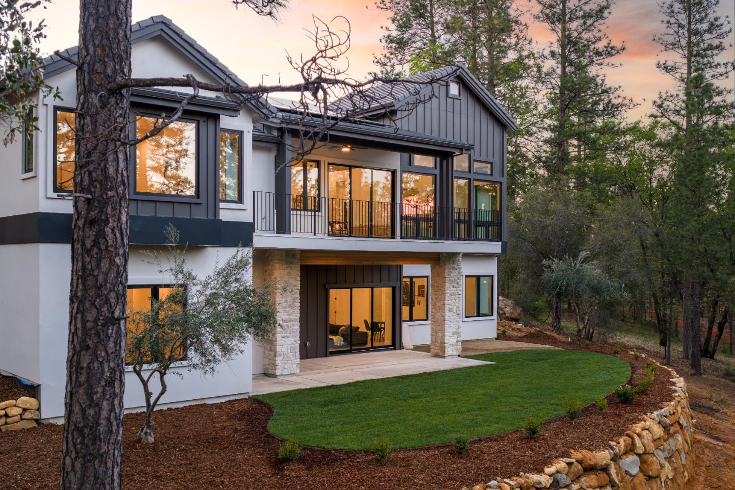 1632 The Point Meadow Vista, CA 95722 - Photo 43 of 60 a view of a brick house with a large windows and a yard with plants and large trees