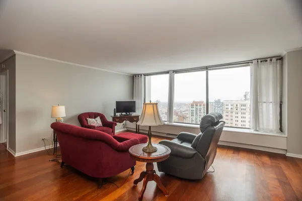 a living room with furniture and a large window