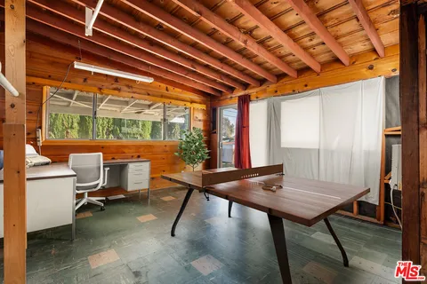 a room with table and chairs