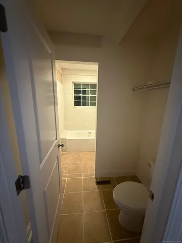 a view of a garden with wooden fence