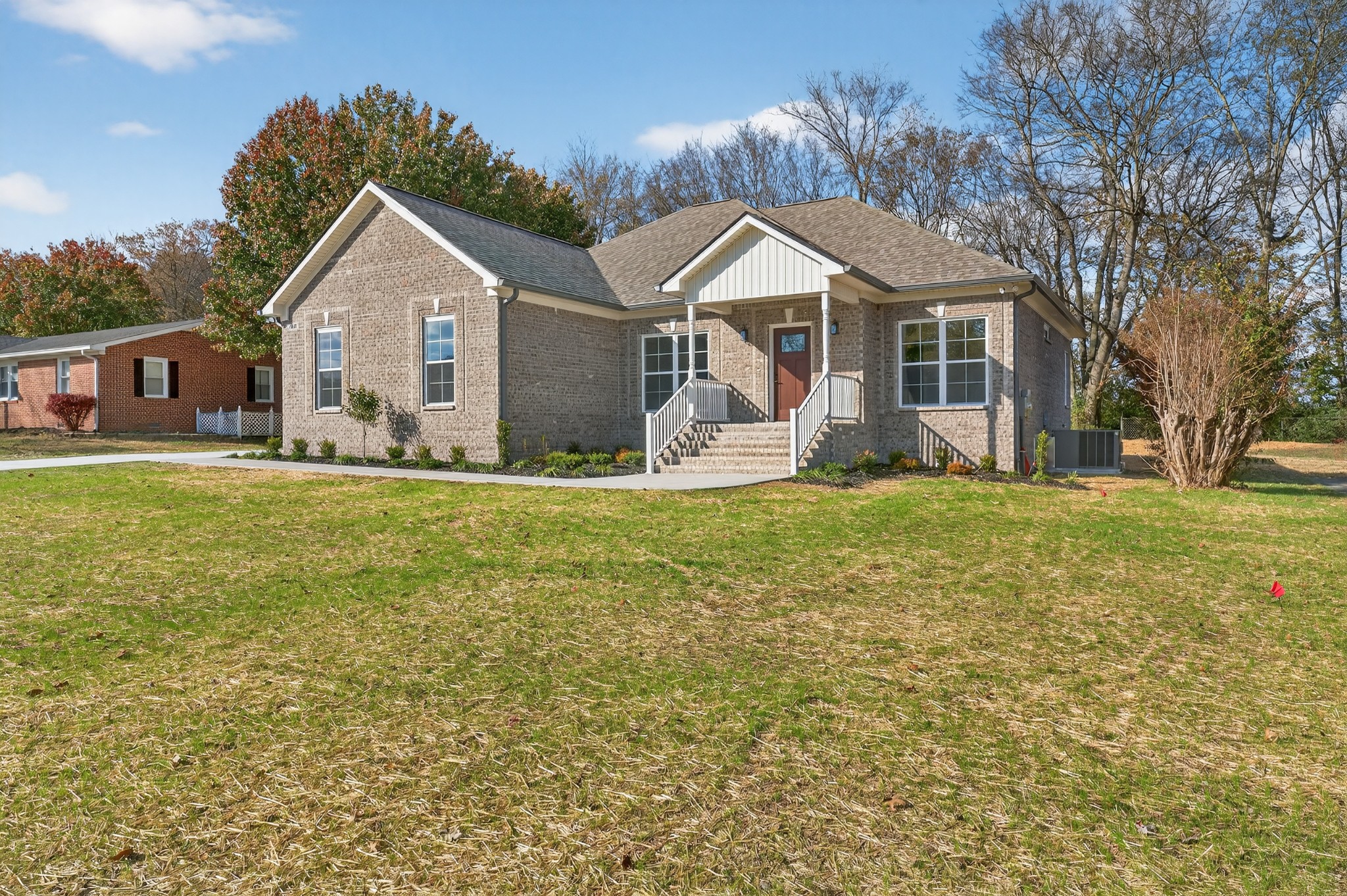 702 Meadow Road Mount Pleasant, TN 38474 - Photo 1 of 51 a front view of a house with a yard