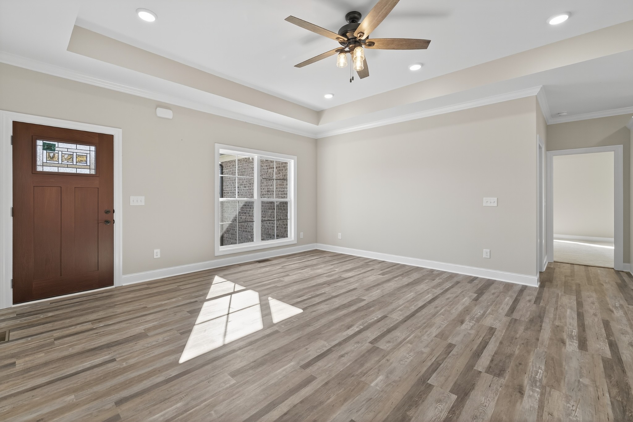 702 Meadow Road Mount Pleasant, TN 38474 - Photo 11 of 51 a view of an empty room with wooden floor and a window