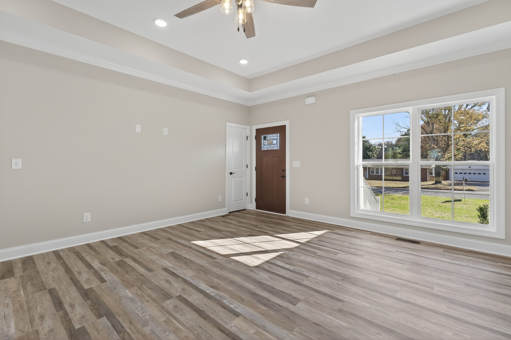 702 Meadow Road Mount Pleasant, TN 38474 - Photo 13 of 51 a view of an empty room with wooden floor and a window