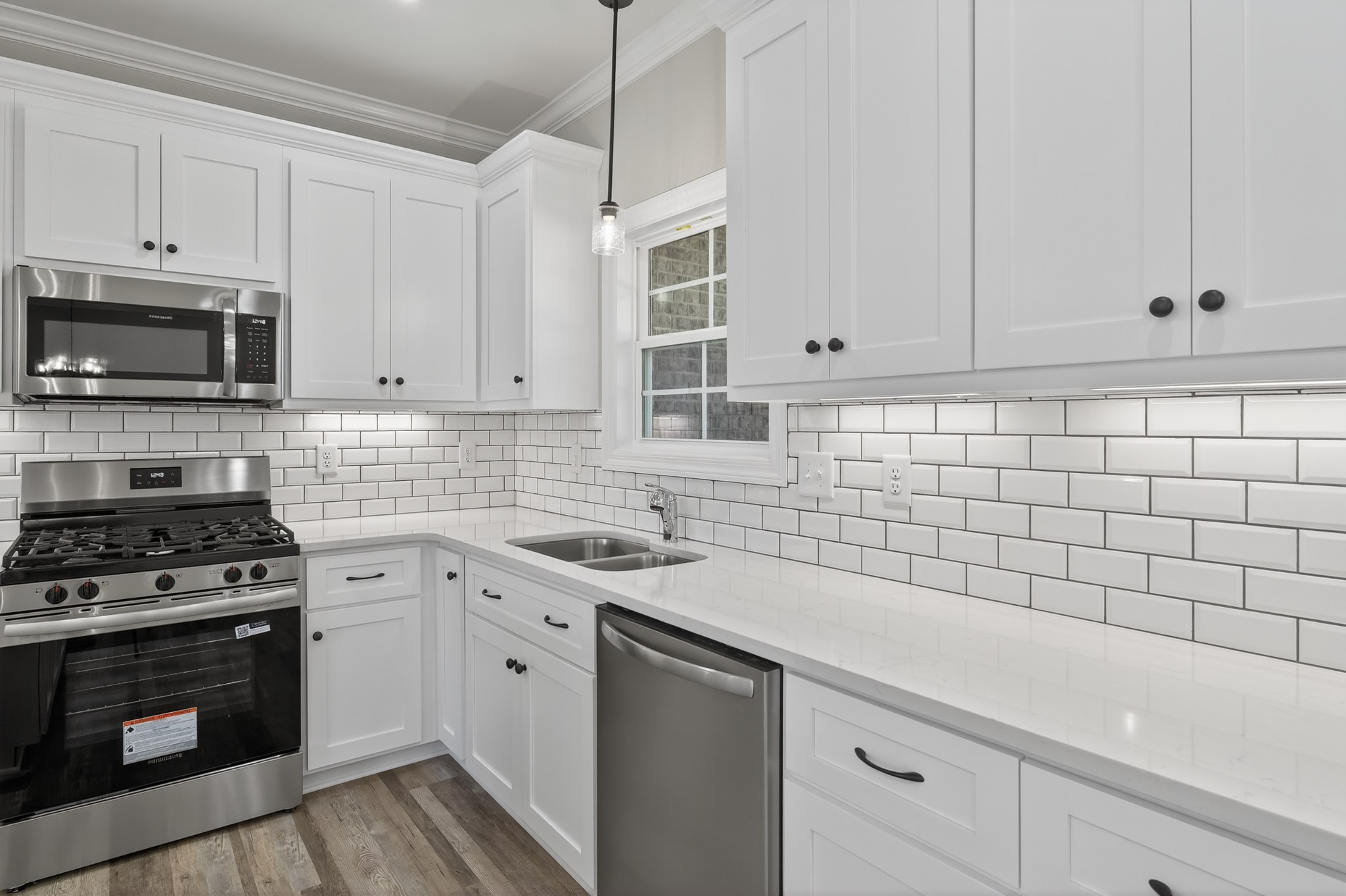 702 Meadow Road Mount Pleasant, TN 38474 - Photo 18 of 51 a kitchen with a sink stove and cabinets