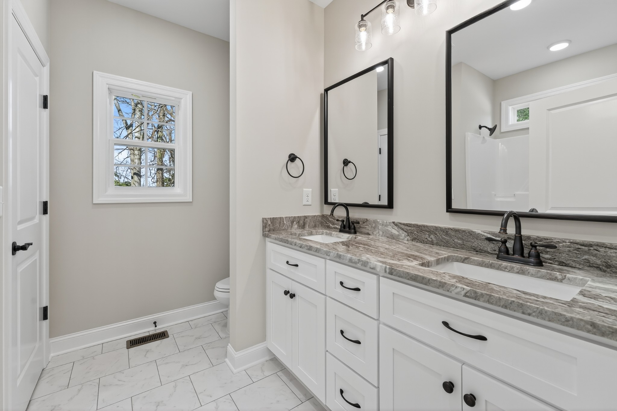 702 Meadow Road Mount Pleasant, TN 38474 - Photo 29 of 51 a bathroom with a granite countertop sink mirror and toilet