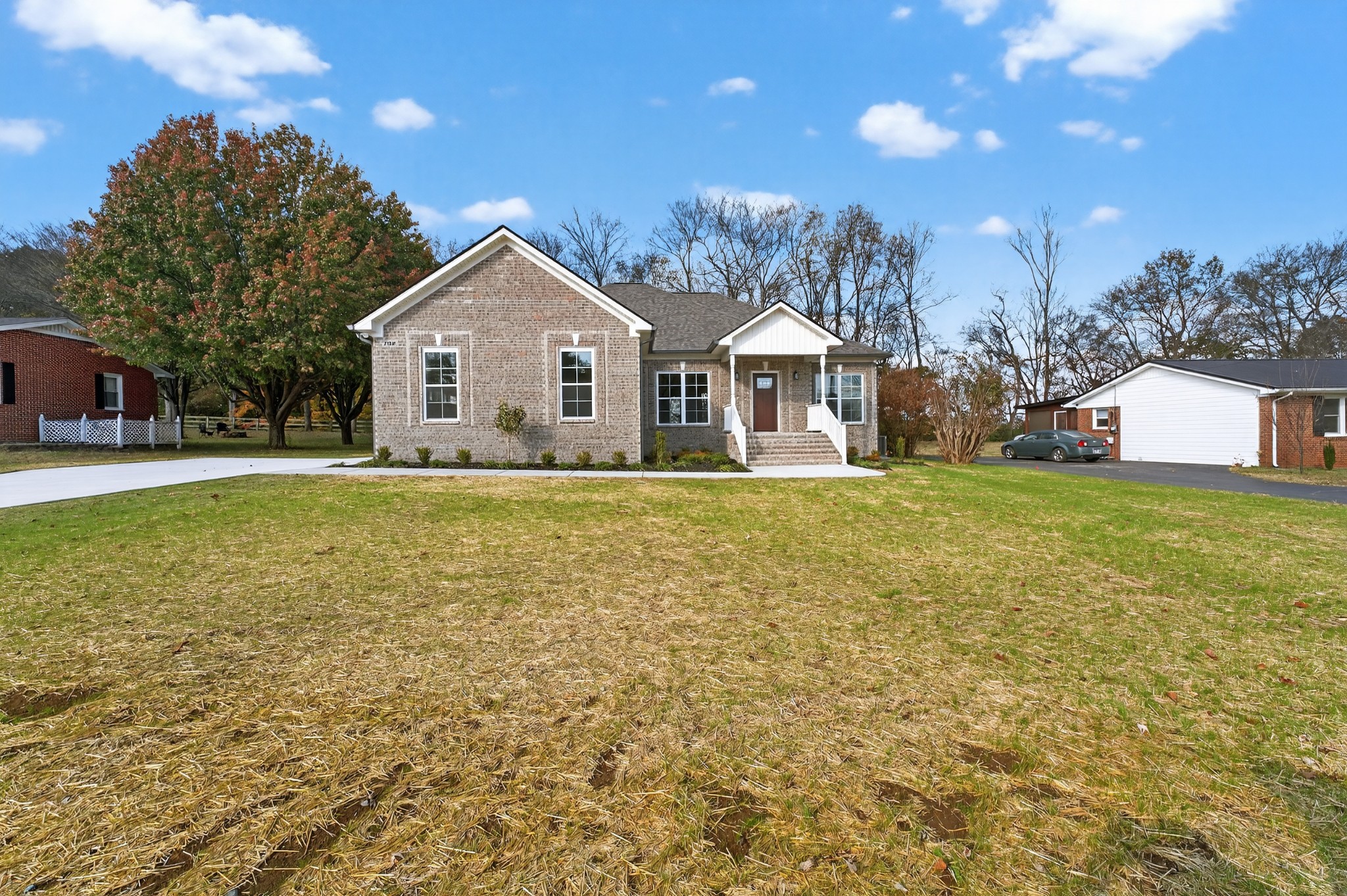 702 Meadow Road Mount Pleasant, TN 38474 - Photo 3 of 51 a view of a house with a yard and garage