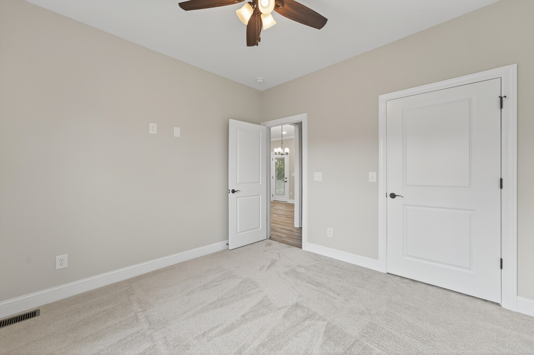 702 Meadow Road Mount Pleasant, TN 38474 - Photo 38 of 51 an empty room with chandelier fan