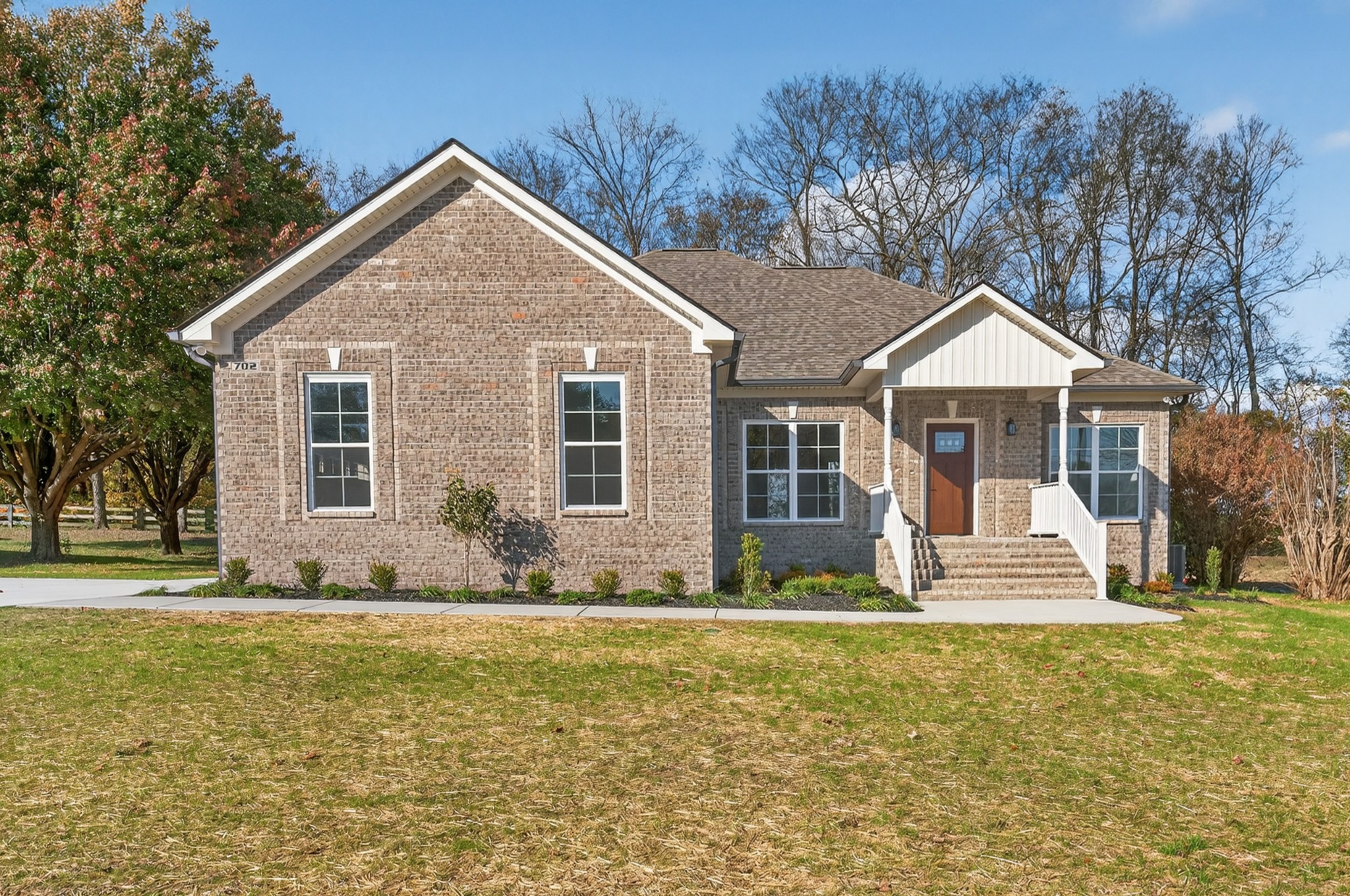 702 Meadow Road Mount Pleasant, TN 38474 - Photo 4 of 51 a front view of a house with a yard