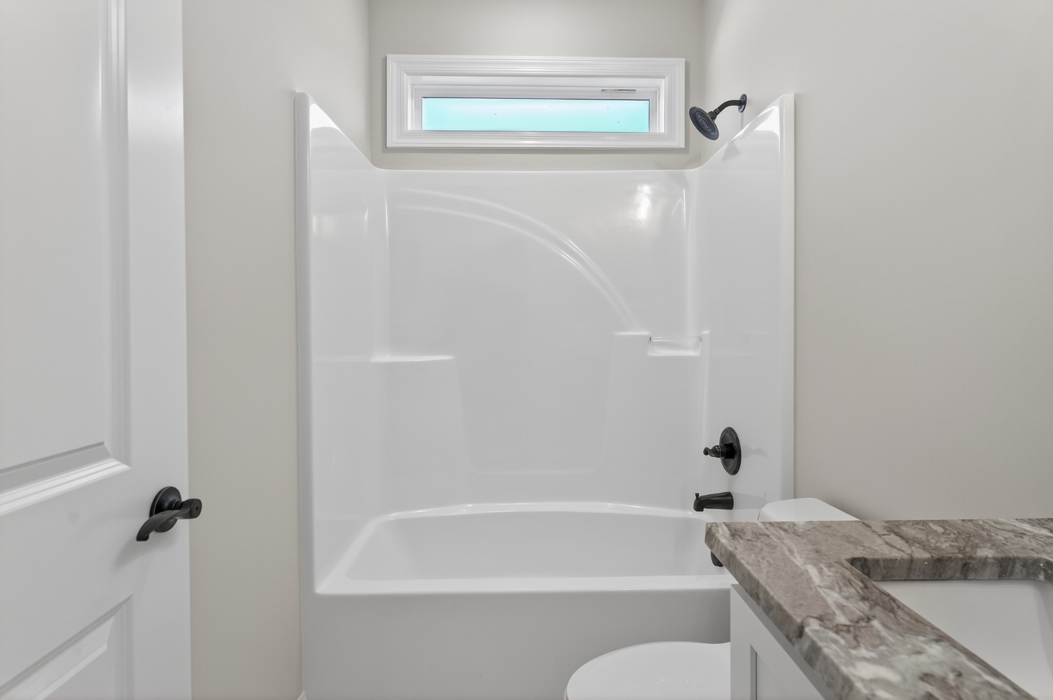 702 Meadow Road Mount Pleasant, TN 38474 - Photo 41 of 51 a bathroom with a granite countertop bathtub shower sink vanity and a toilet