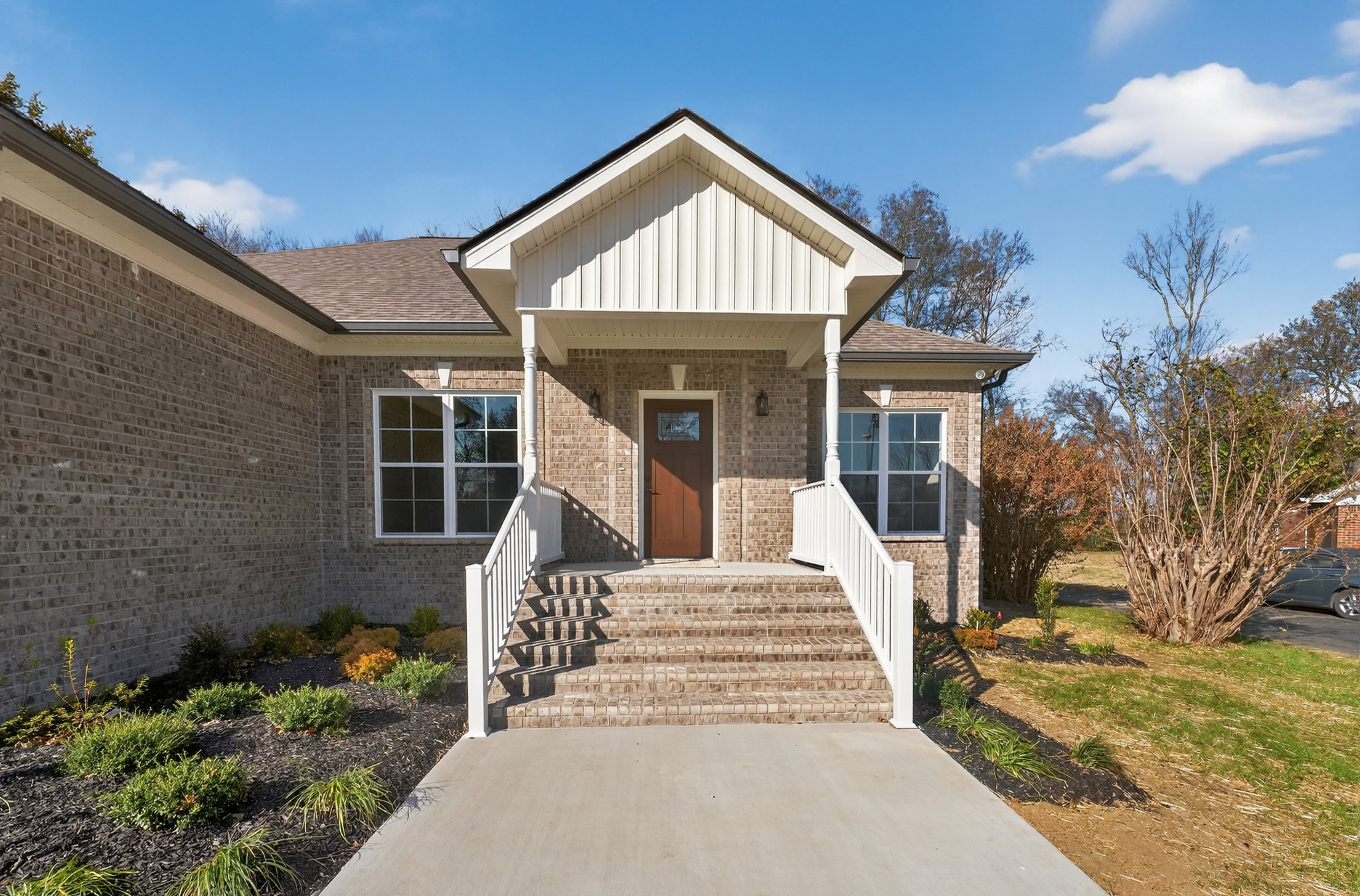 702 Meadow Road Mount Pleasant, TN 38474 - Photo 6 of 51 a front view of a house with a yard