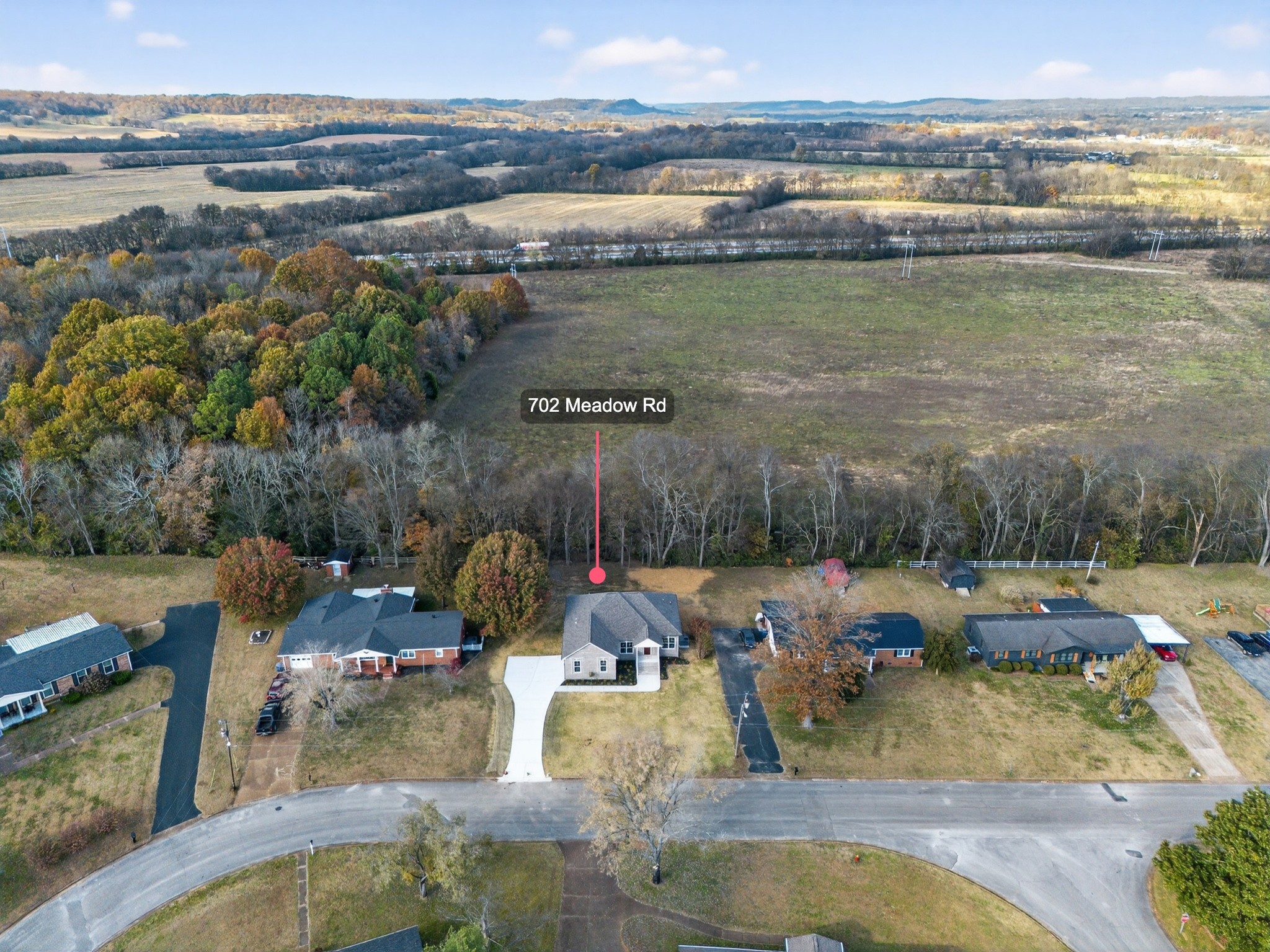 702 Meadow Road Mount Pleasant, TN 38474 - Photo 8 of 51 a view of a lake with couches and city view