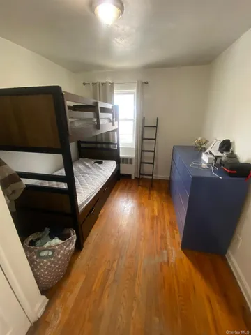 a living room with furniture and a dresser