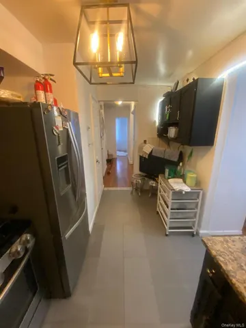 a bedroom with furniture and a chandelier