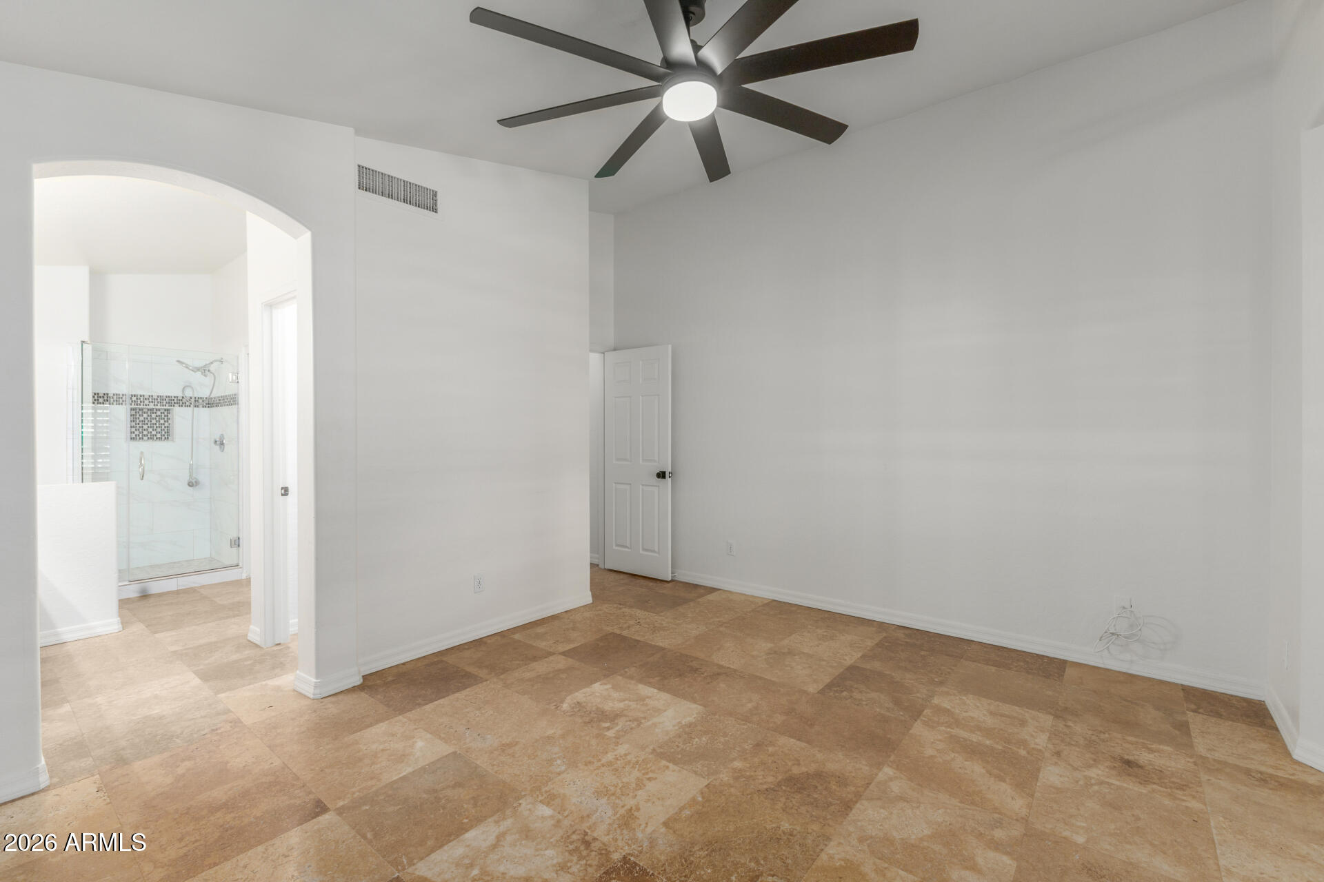 16426 South 29th Street Phoenix, AZ 85048 - Photo 13 of 21 an empty room with fan and entrance