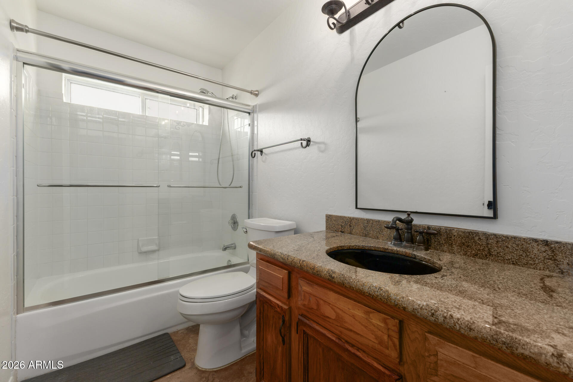 16426 South 29th Street Phoenix, AZ 85048 - Photo 20 of 21 a bathroom with a granite countertop sink toilet and shower