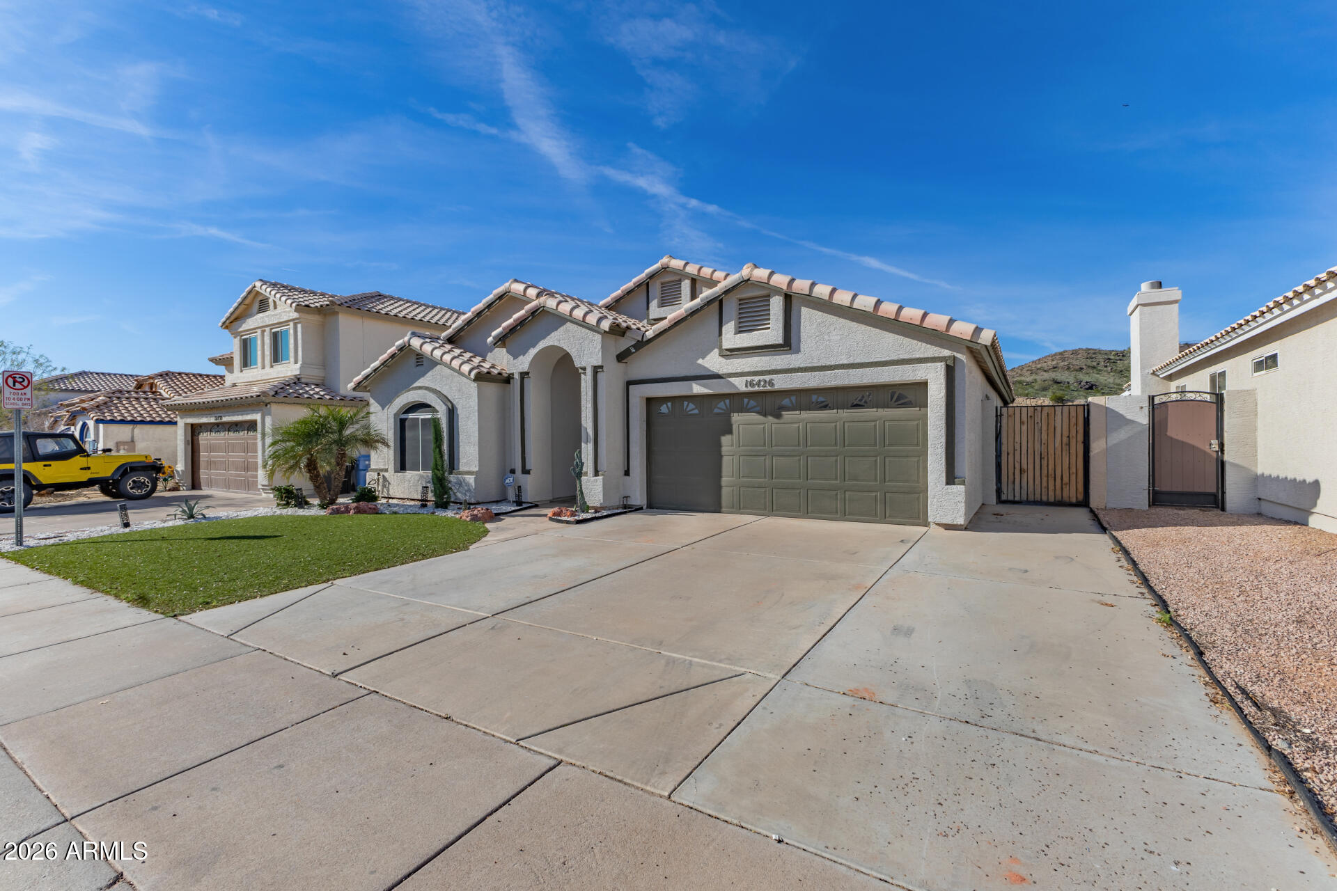 16426 South 29th Street Phoenix, AZ 85048 - Photo 2 of 21 a front view of a house with yard and green space