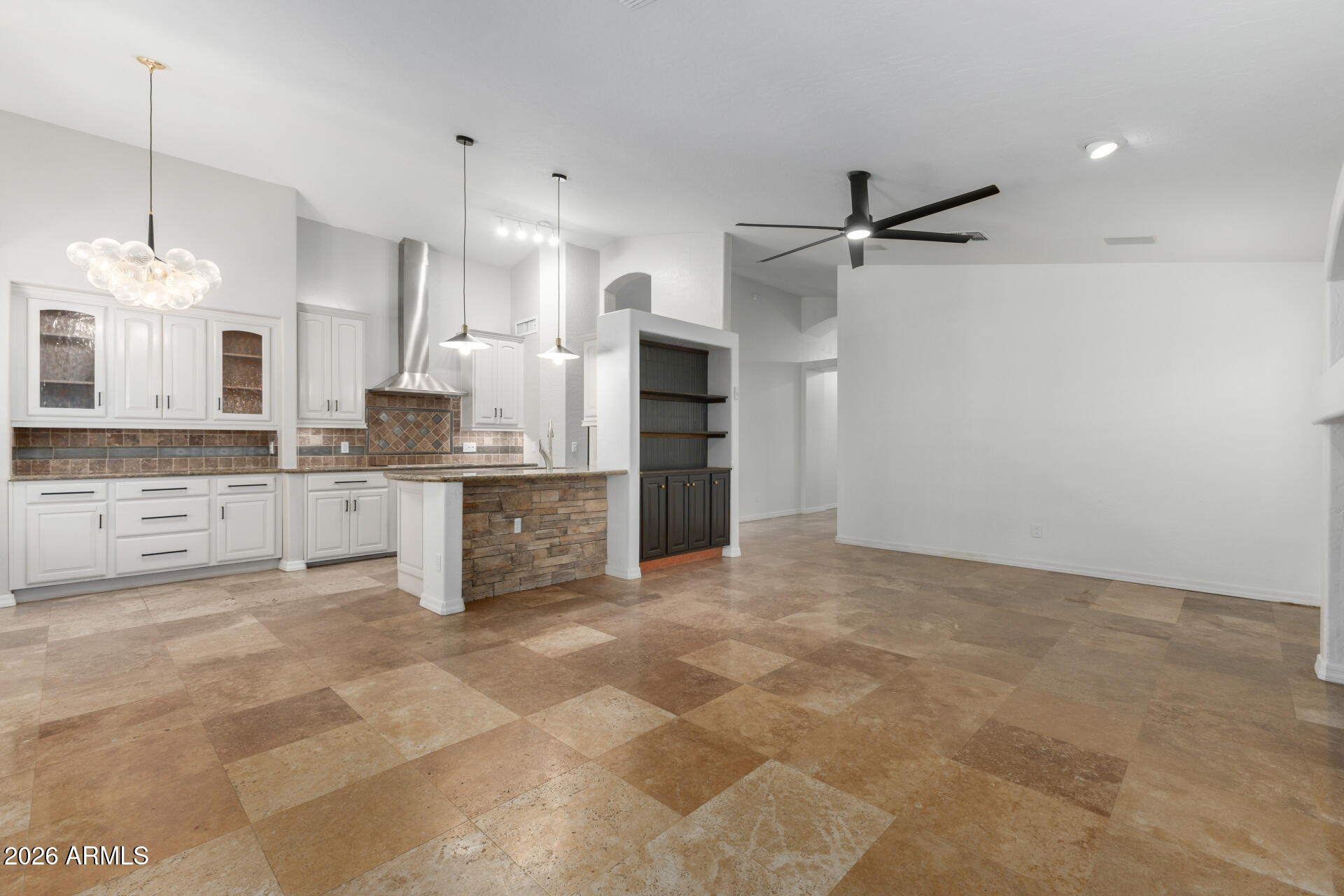 16426 South 29th Street Phoenix, AZ 85048 - Photo 6 of 21 a large kitchen with cabinets and a wooden floor