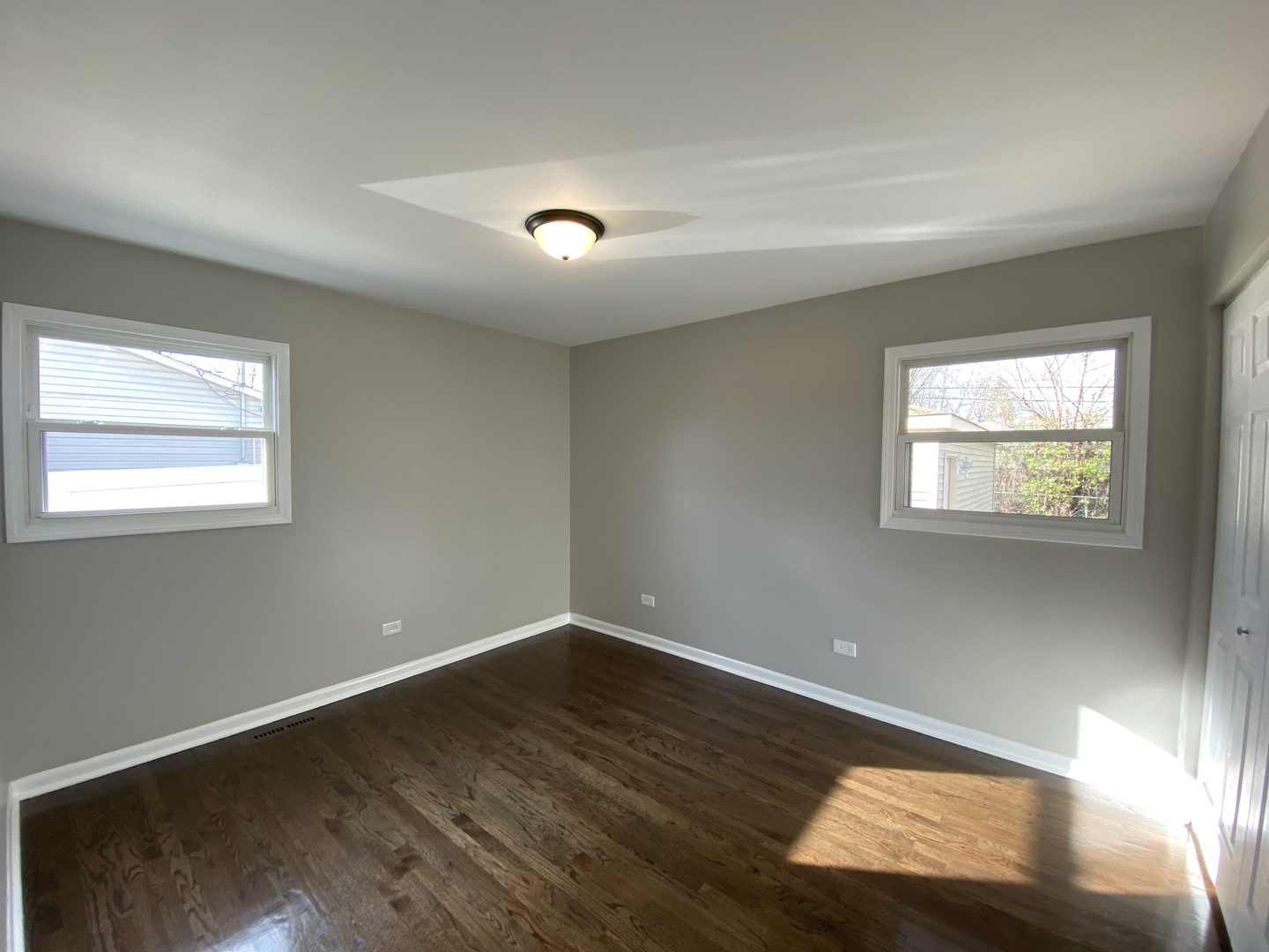 18 South Oltendorf Road Streamwood, IL 60107 - Photo 12 of 21 an empty room with wooden floor and windows