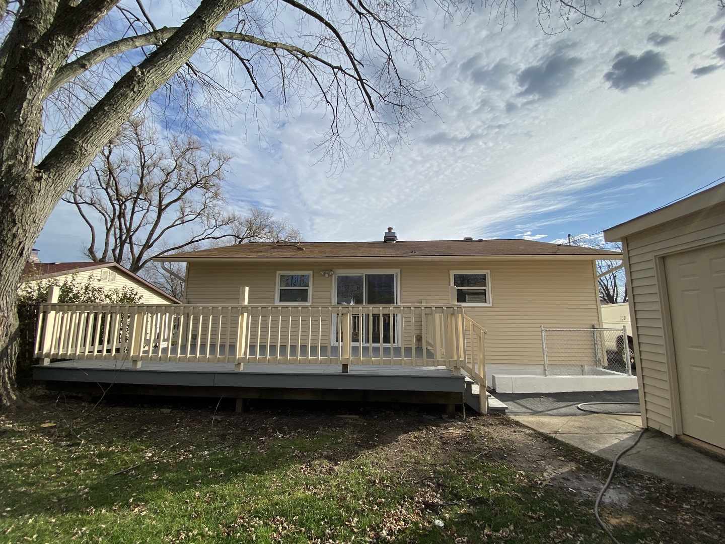 18 South Oltendorf Road Streamwood, IL 60107 - Photo 21 of 21 a view of a house with a small yard and wooden fence