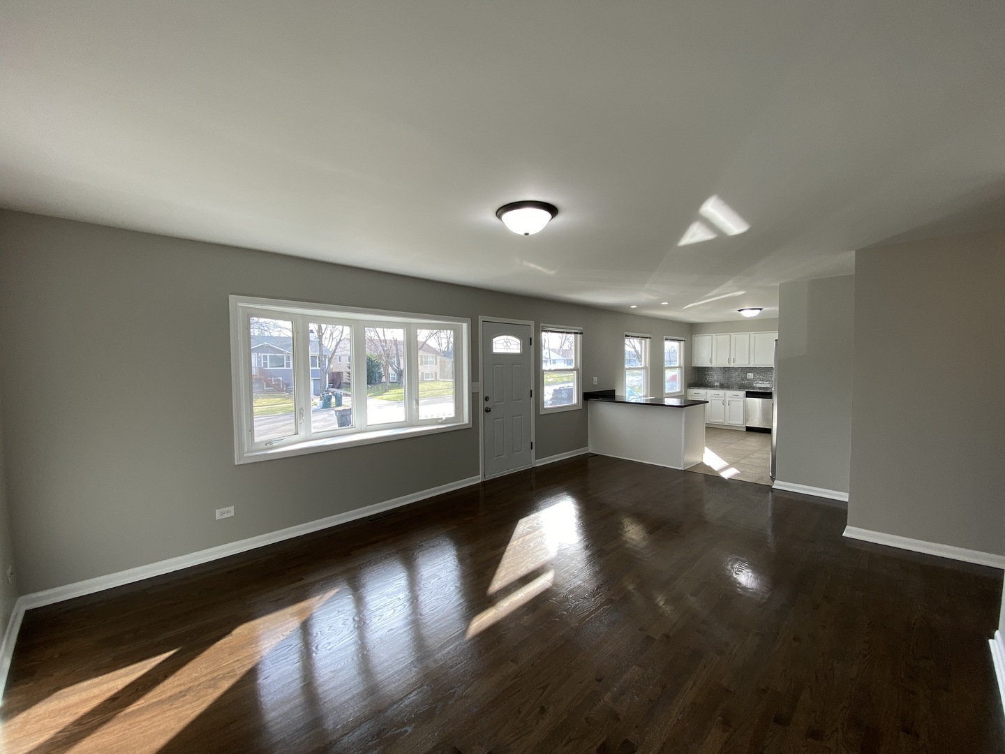 18 South Oltendorf Road Streamwood, IL 60107 - Photo 5 of 21 a view of an empty room and kitchen with a window