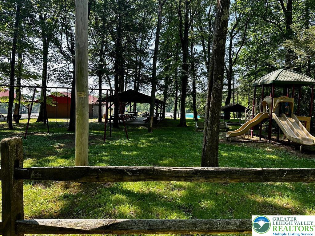 500 Sumac Court Kunkletown, PA 18058 - Photo 8 of 12 a view of swimming pool from a lake view