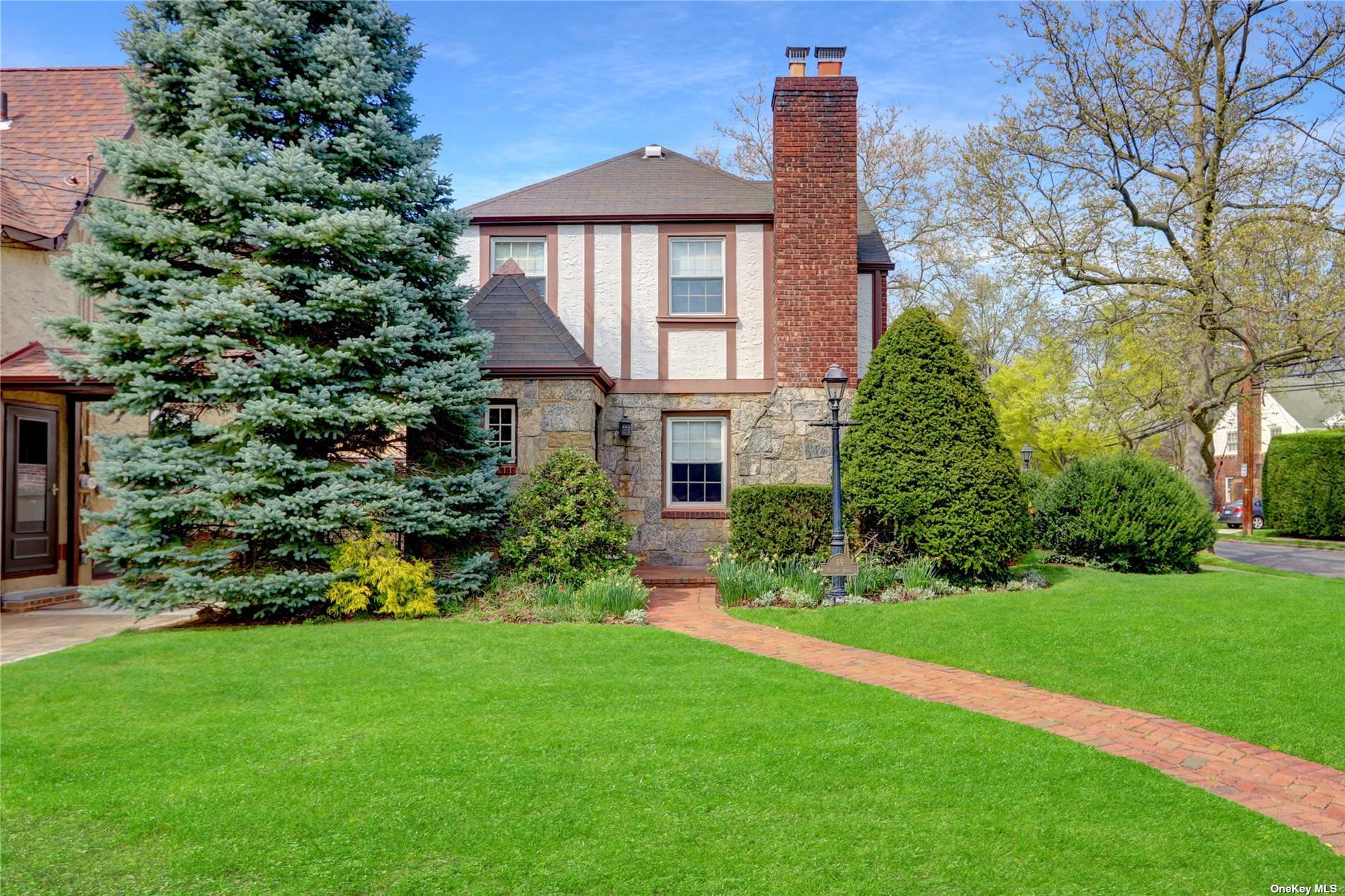 69 Utterby Road Malverne, NY 11565 - Photo 1 of 1 a front view of a house with a yard