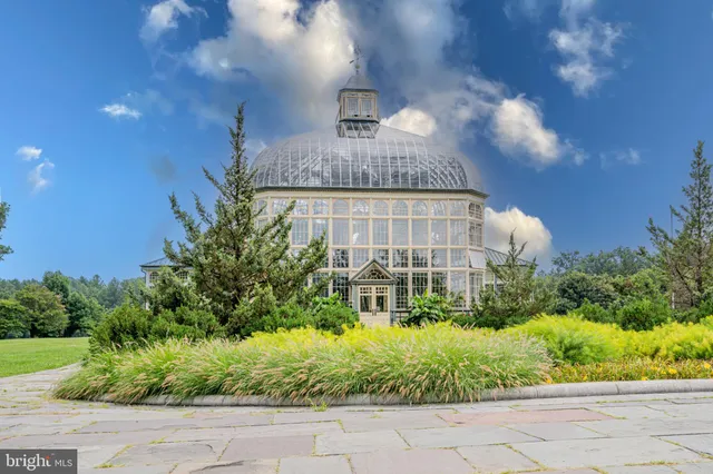 a front view of building with yard