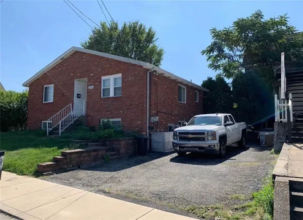 a car parked in front of a house